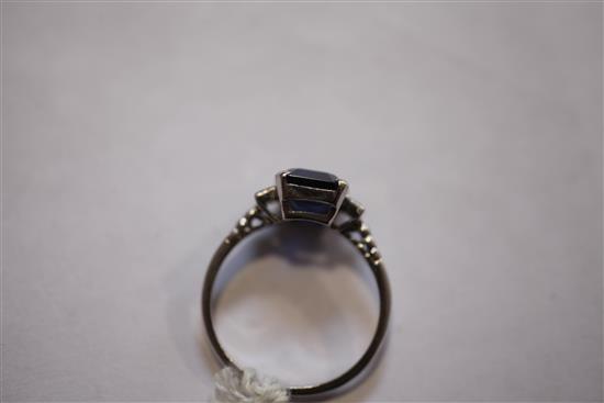 A mid 20th century platinum, sapphire and diamond ring, size 0.